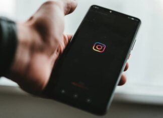 Creators worry Instagram is hiding their posts Instagram logo displayed on a phone