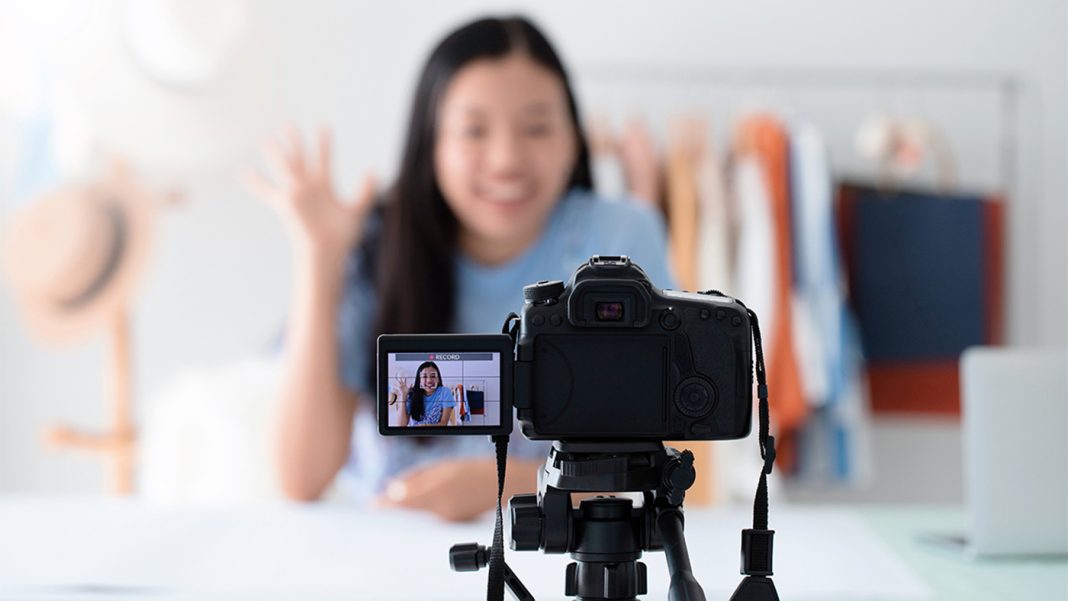 asian-woman-talking-with-camera-to-recording-video-GL9VMJZ Building Your Ideal YouTube Studio