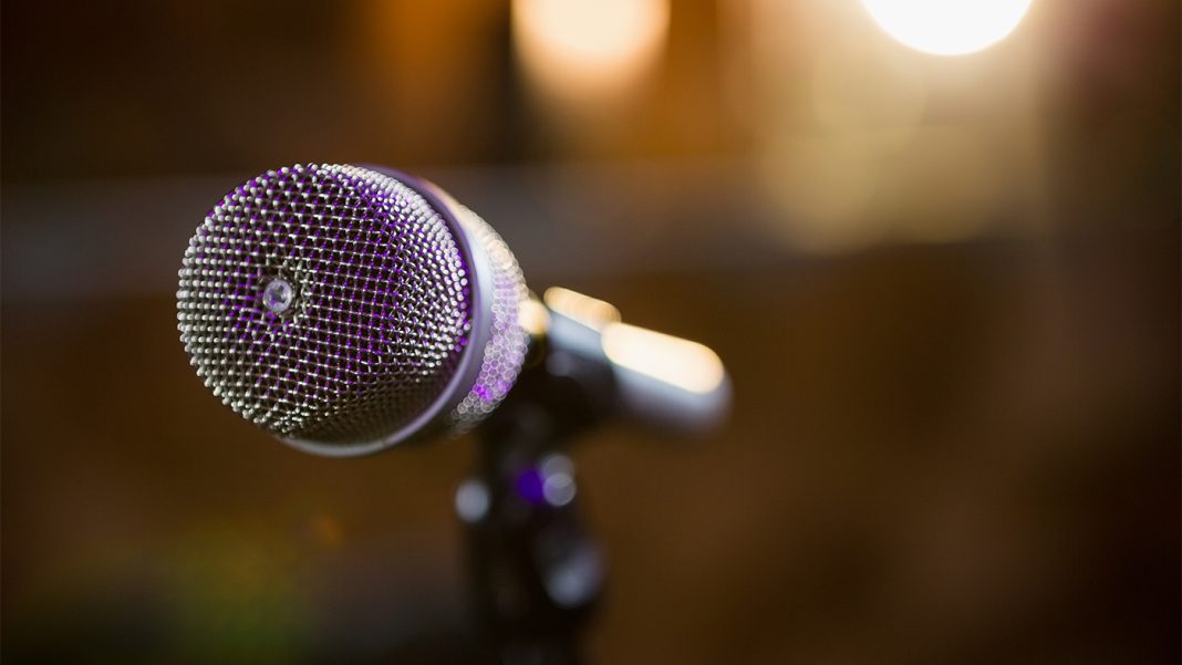 close-up-of-microphone-2025-04-03-12-27-12-utc YouTube tests AI lip-syncing to complement auto-dubs